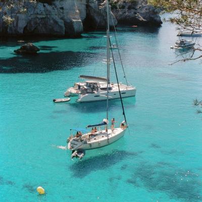 Boats in turquoise waters in menorca